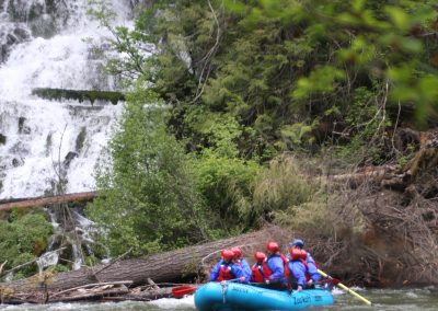 Rafters looking at the Klickitat river Wonder Falls while on the river.